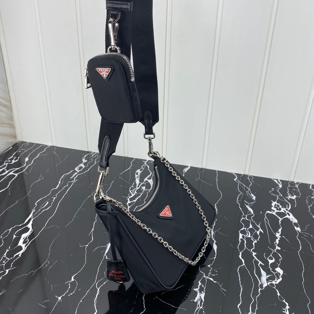 PRADA HOBO 22 BAG IN BLACK RE-NYLON WITH RED LOGO