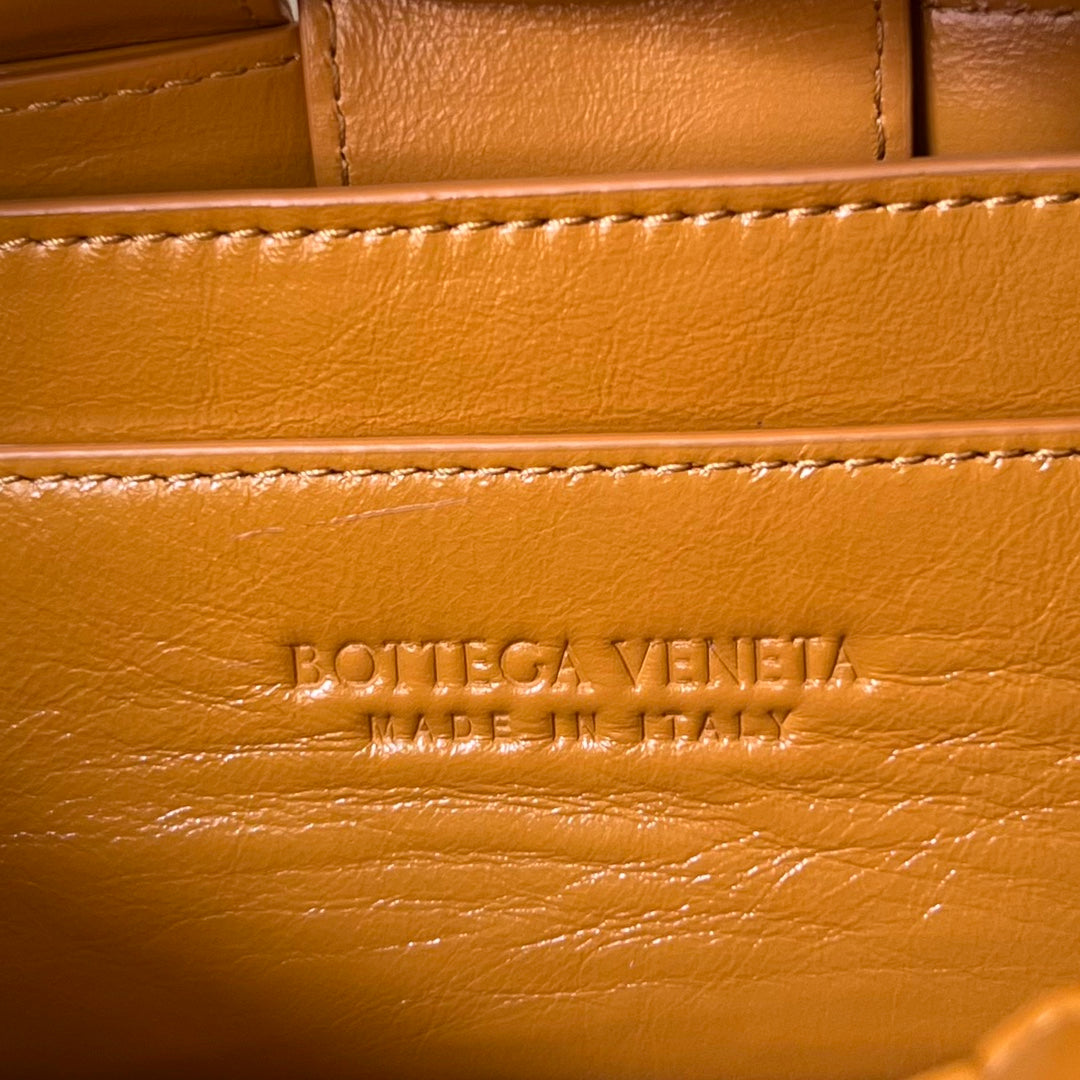 BOTTEGA VENETA SMALL BRICK CASSETTE 23 IN SANDSTONE ORANGE SOFT LAMBSKIN