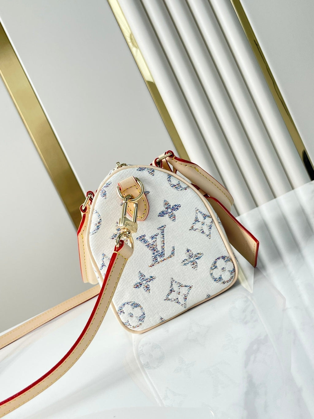 LOUIS VUITTON SPEEDY BANDOULIÈRE 20 IN WHITE MONOGRAM JACQUARD FABRIC AND BEIGE CALFSKIN TRIM