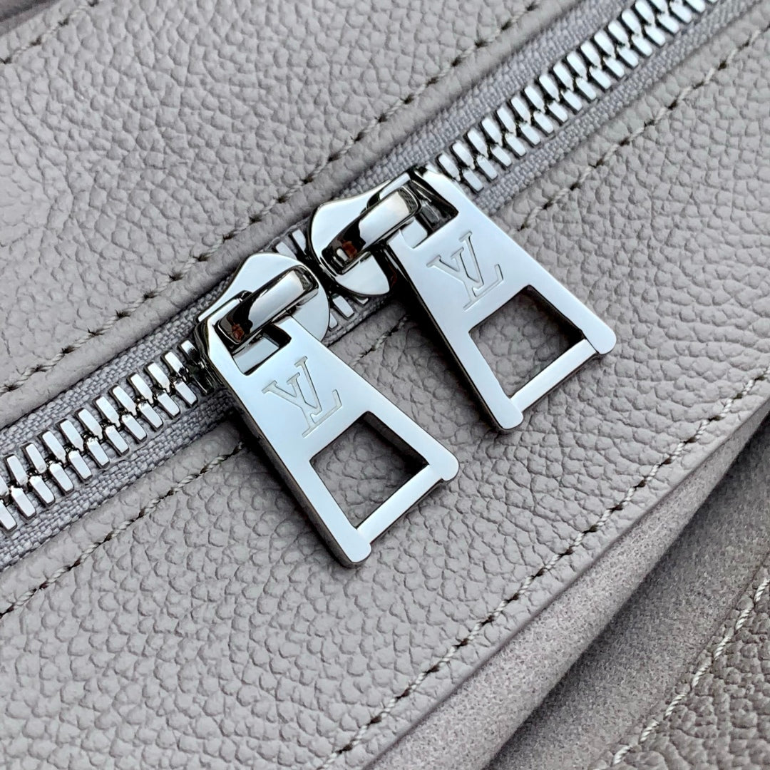 LOUIS VUITTON ONTHEGO EAST WEST BAG 25 IN BICOLOR MONOGRAM EMPREINTE LEATHER
