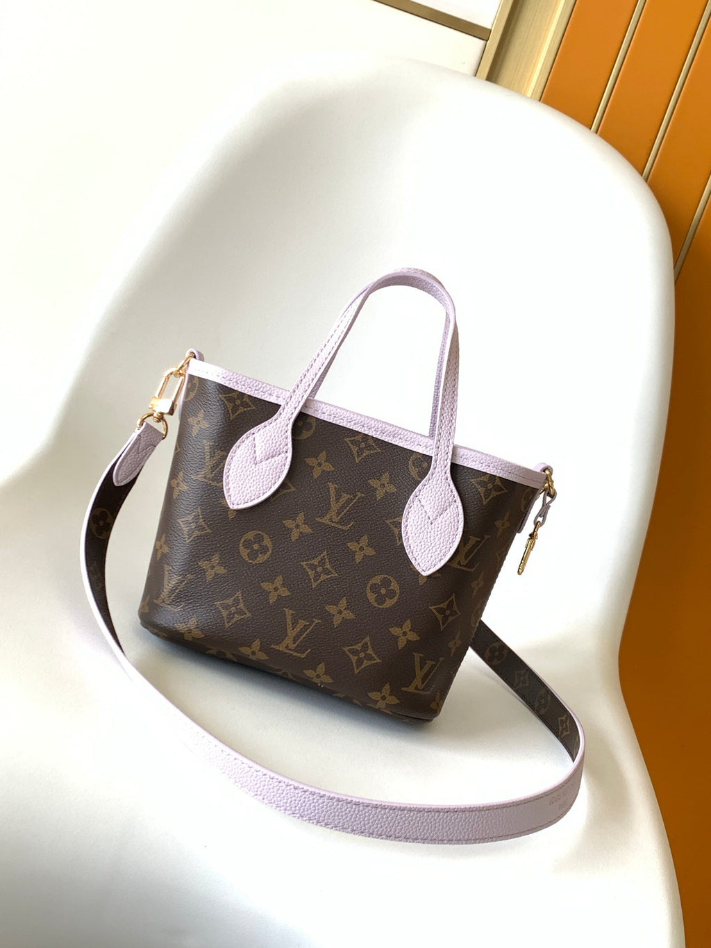 LOUIS VUITTON LV 25S NEVERFULL BANDOULIÈRE INSIDE OUT BB 24 IN LIGHT PURPLE AND BROWN CALFSKIN